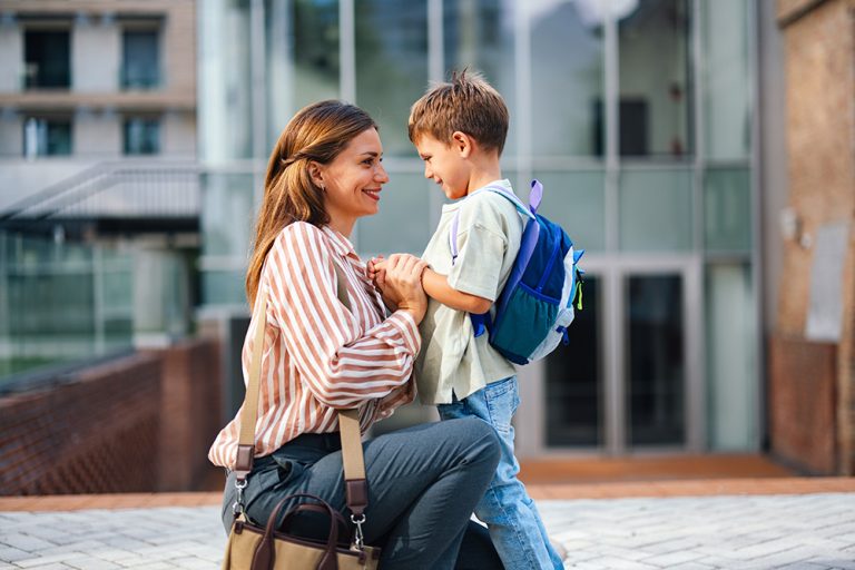 Mother and Son at School Entrance for First Day Back to School